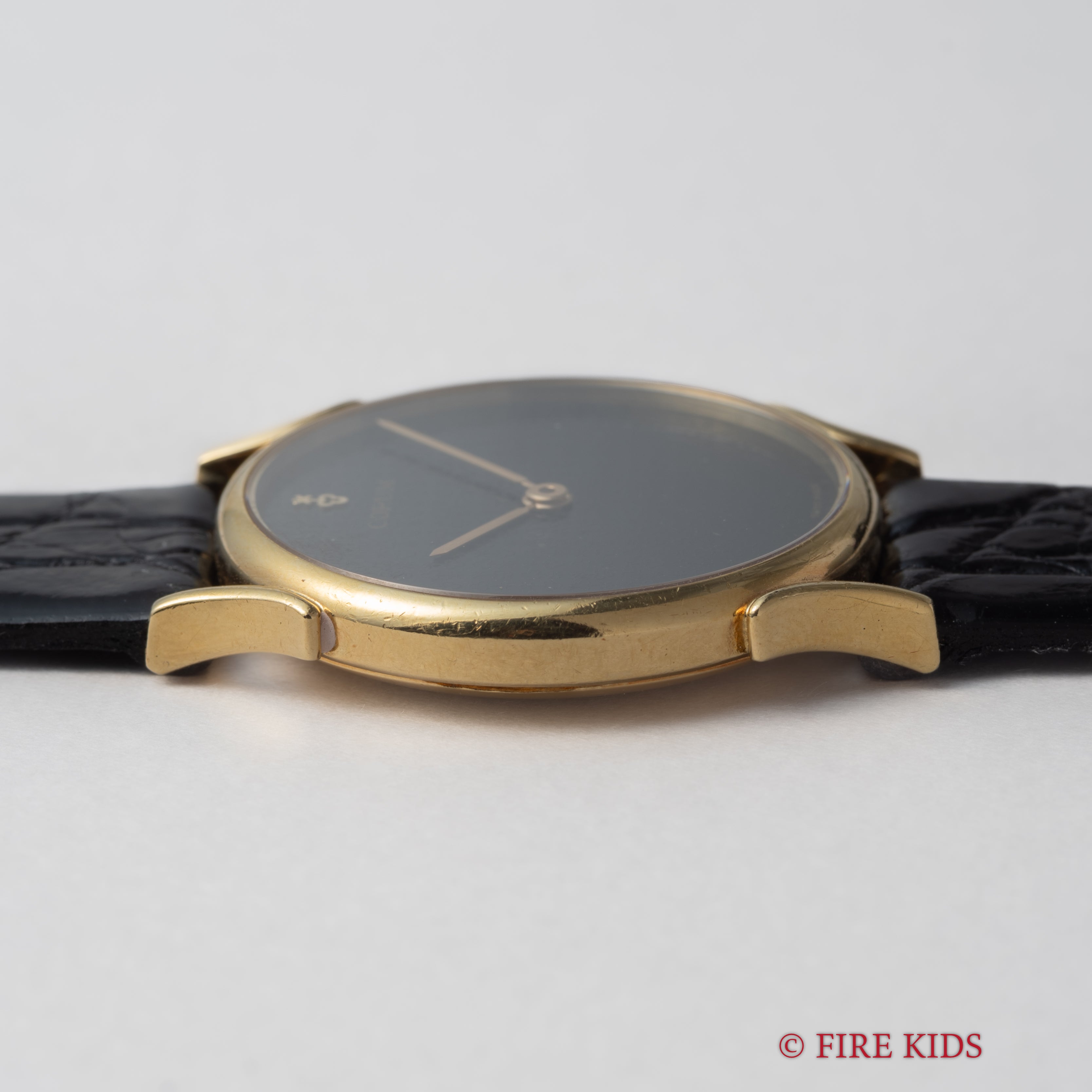 コルム 18金無垢ドレスウォッチ 1990年代製 ブラックロゴダイヤル 手巻 Cal.7001 純正GP尾錠