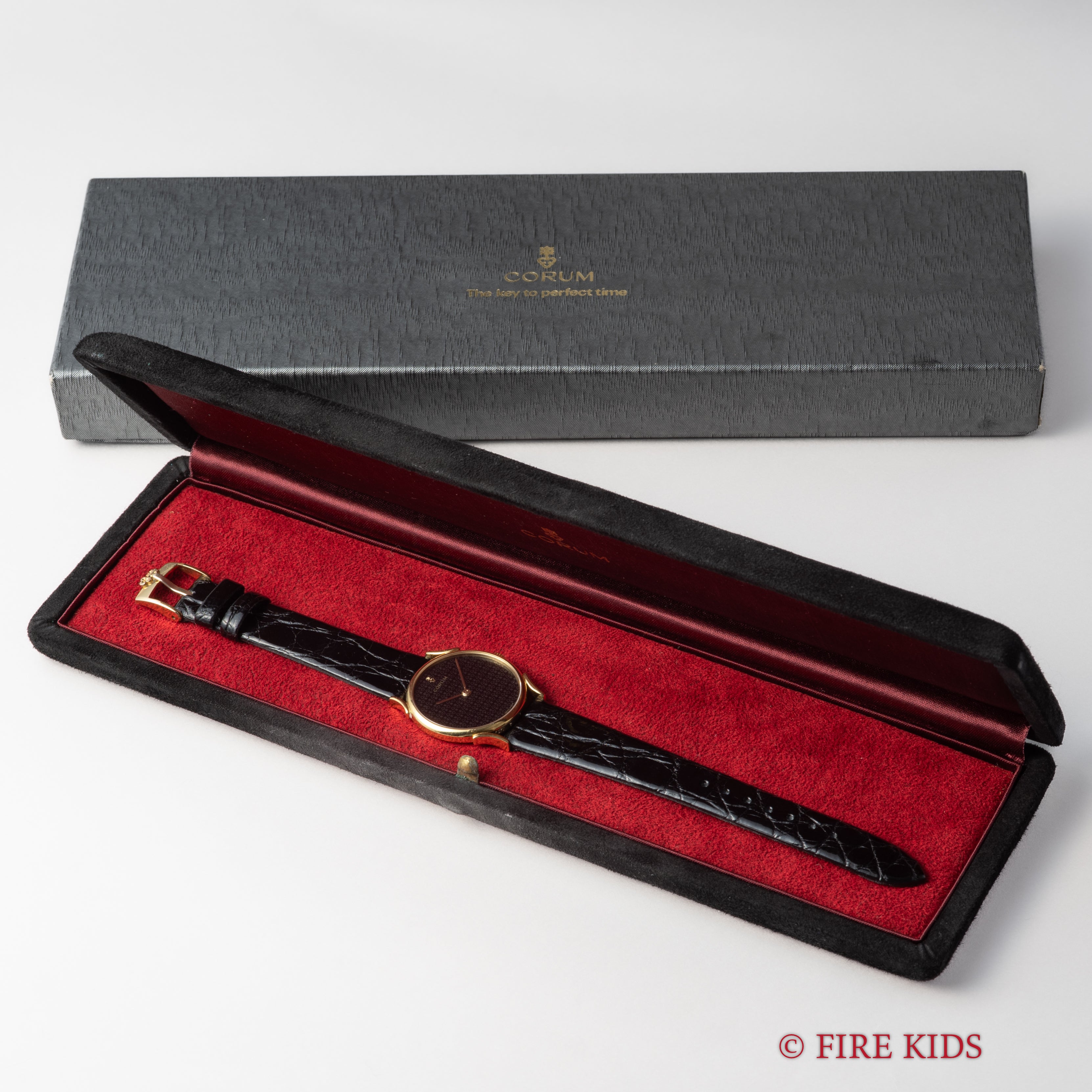 コルム 18金無垢ドレスウォッチ 1990年代製 ブラックロゴダイヤル 手巻 Cal.7001 純正GP尾錠