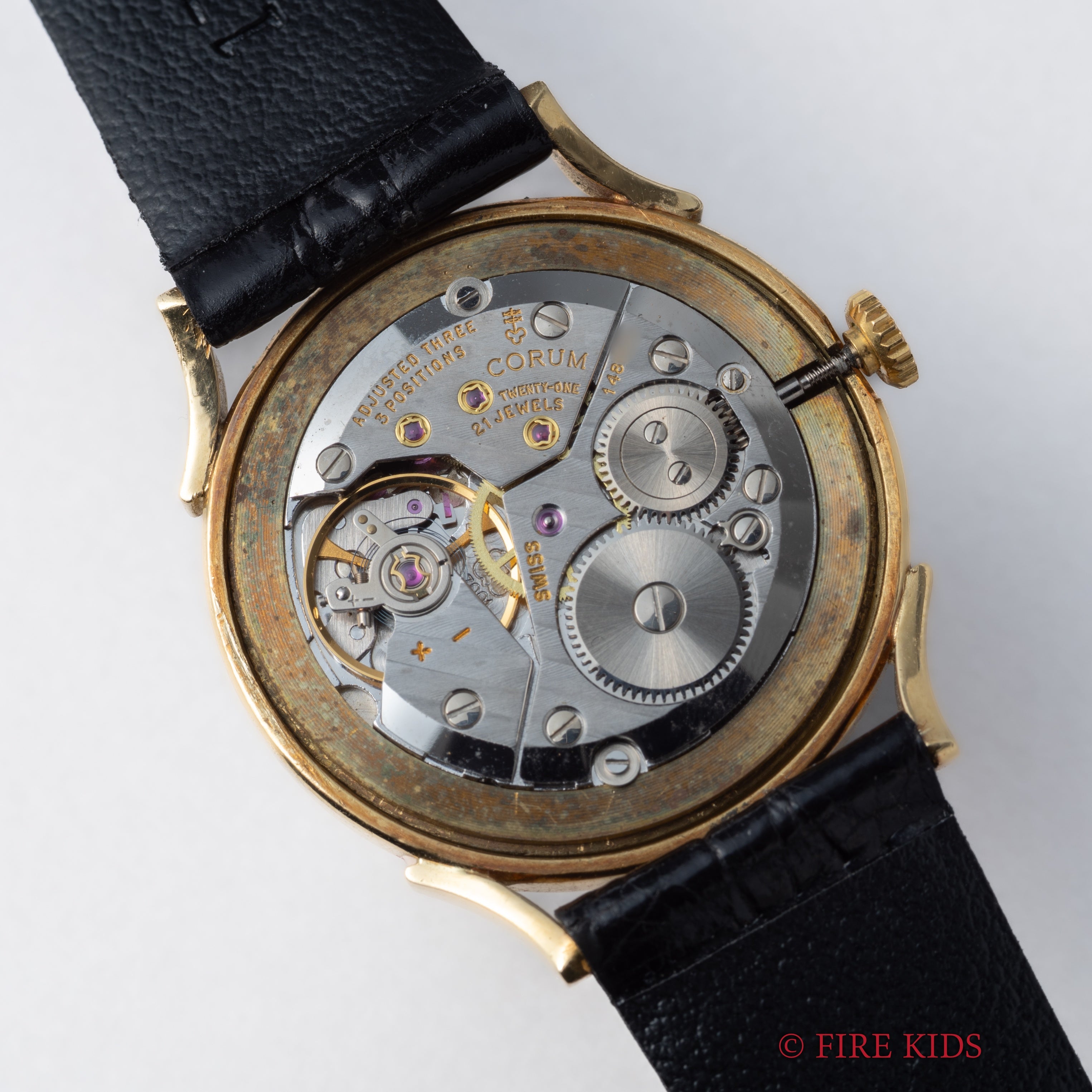 コルム 18金無垢ドレスウォッチ 1990年代製 ブラックロゴダイヤル 手巻 Cal.7001 純正GP尾錠