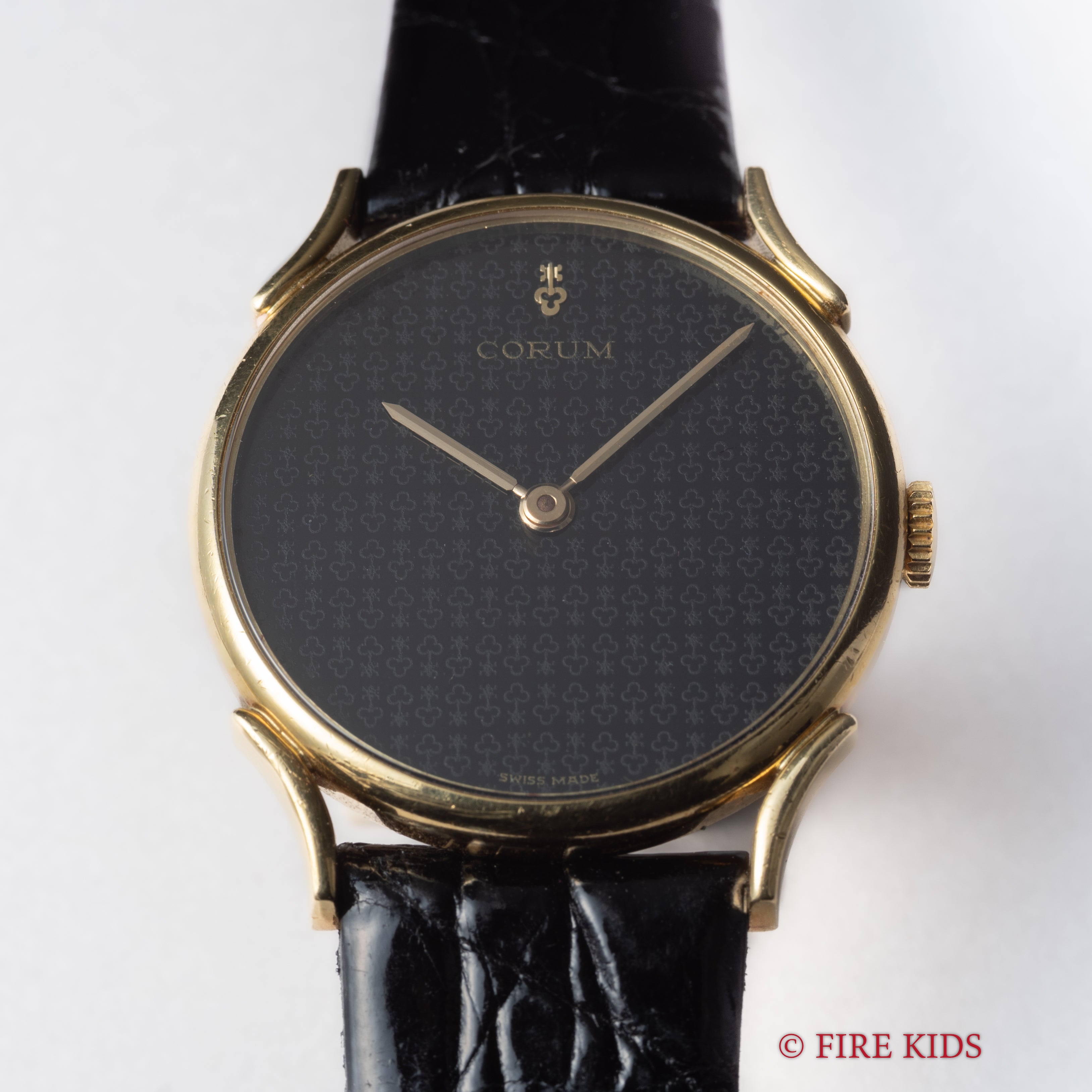 コルム 18金無垢ドレスウォッチ 1990年代製 ブラックロゴダイヤル 手巻 Cal.7001 純正GP尾錠