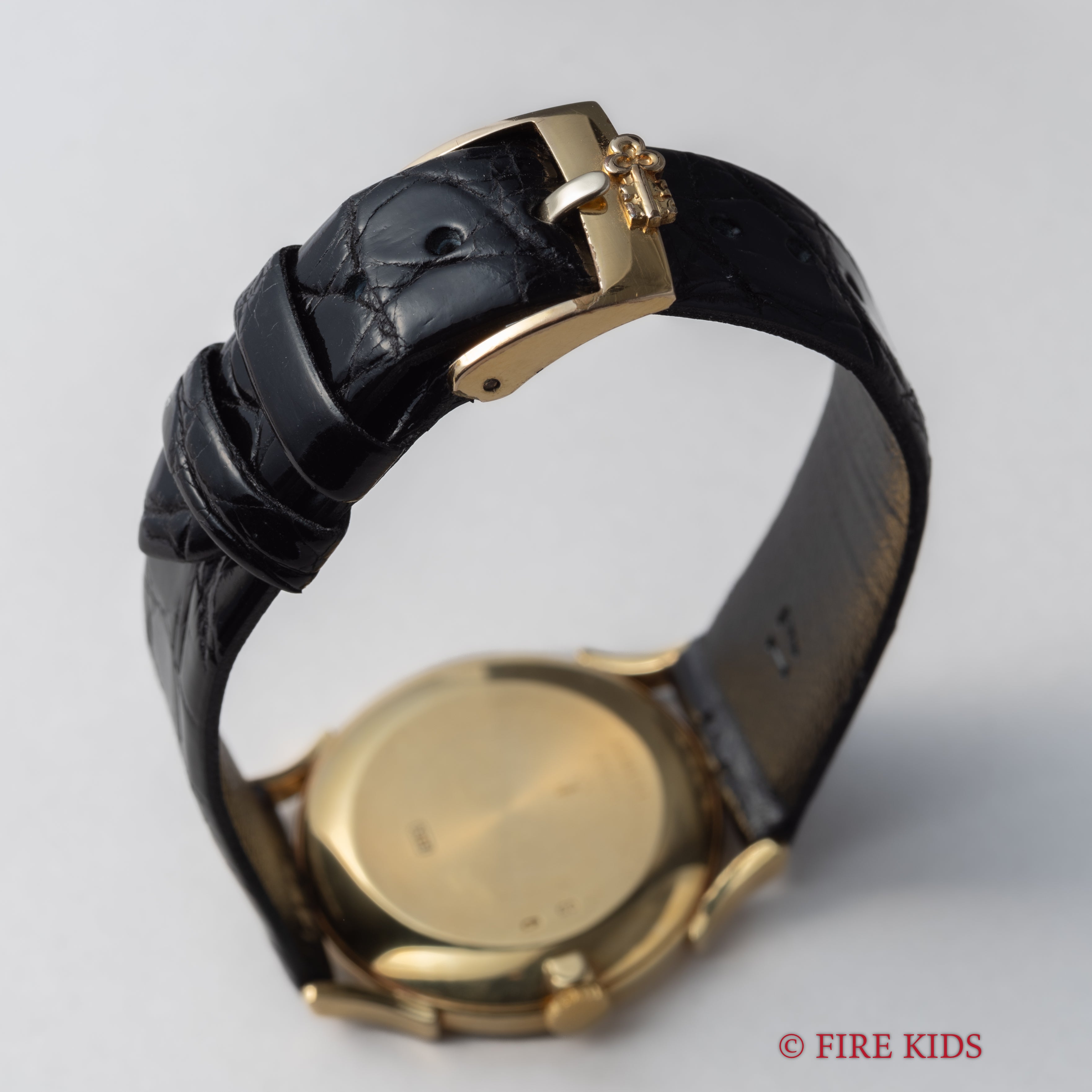 コルム 18金無垢ドレスウォッチ 1990年代製 ブラックロゴダイヤル 手巻 Cal.7001 純正GP尾錠